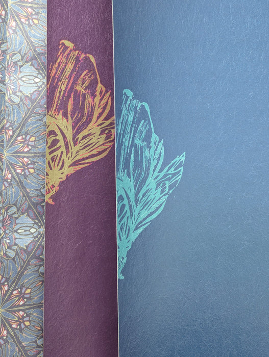 Closeups of segments of the fantastical bee motifs in Wild Lone's "Night Flight" wallpaper, in both the "Electric Blue" and "Purple Jewel" colourways.