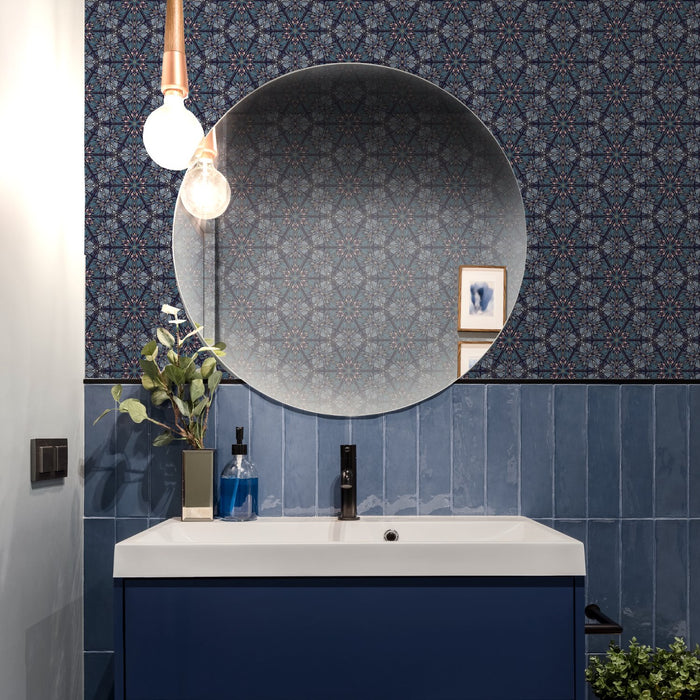 Modern bathroom with exotic, blue and gold wallpaper in an intricate botanical, Art Nouveau and Japanese-inspired design. Wild Lone's "Greenhouse" wallpaper in "Ornamental Blue".